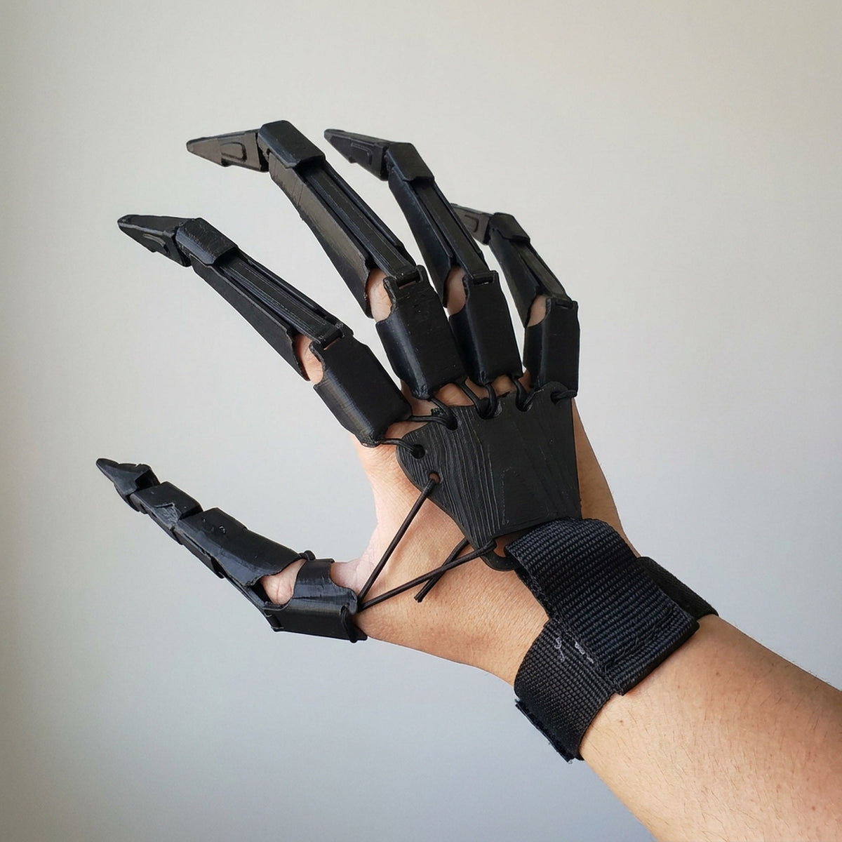 Articulated Finger Extensions Pair with Clawed Digits for Halloween Costumes